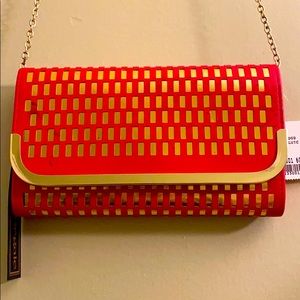 La Regale orange and gold clutch